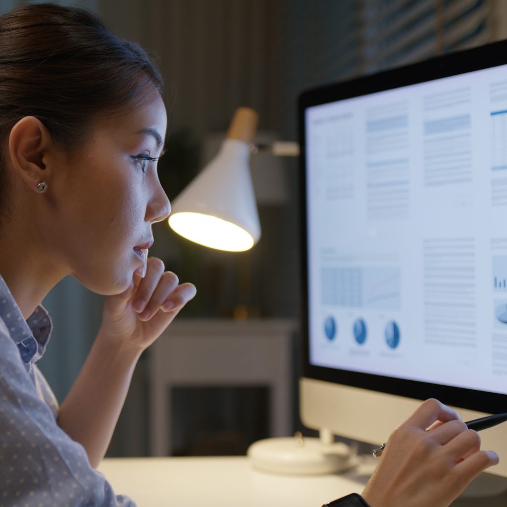 A woman looking over statistics.